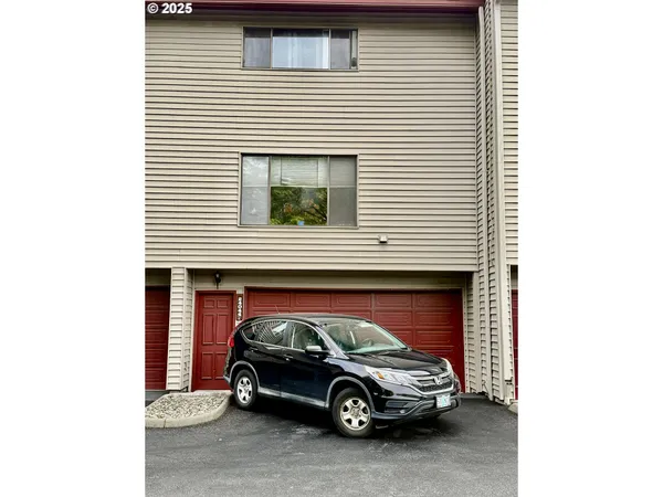 a car parked in front of a house