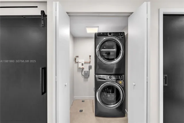 a utility room with dryer and washer