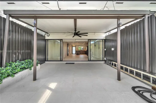 a view of a building with floor to ceiling windows and stairs