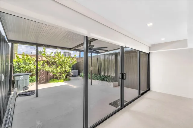 a view of a hallway with a glass door