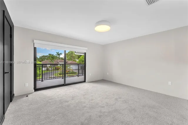 a view of an empty room with a balcony