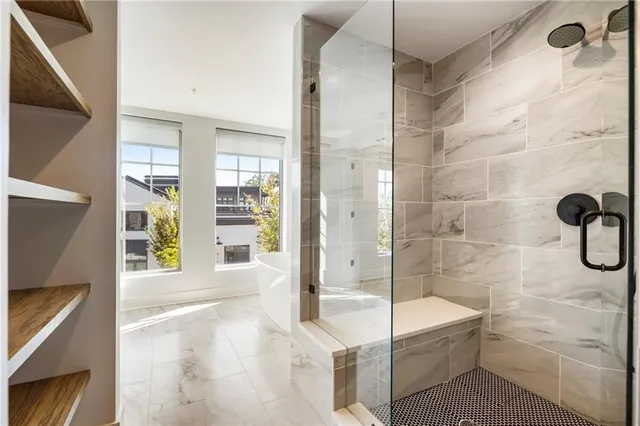 a bathroom with double vanity sinks and a mirror