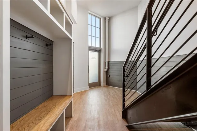 a view of entryway with wooden floor and stairs