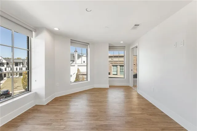 a bathroom with a glass shower door a sink and a bathtub