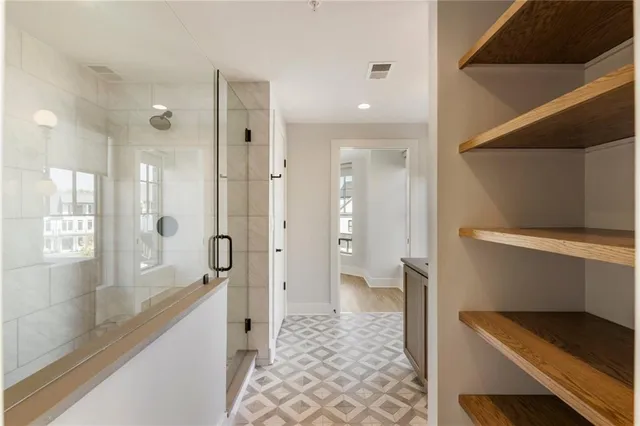 a view of hallway with wooden floor