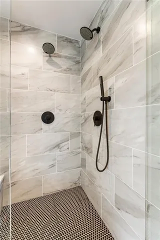 a kitchen with stainless steel appliances granite countertop a stove and a white cabinets