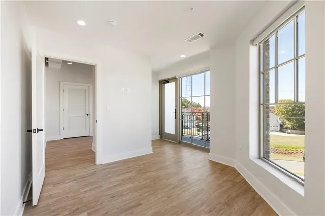 a view of balcony with wooden floor