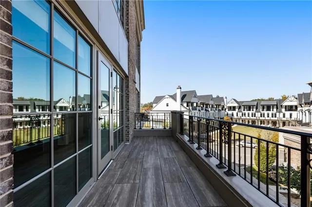 a view of a balcony with wooden floor