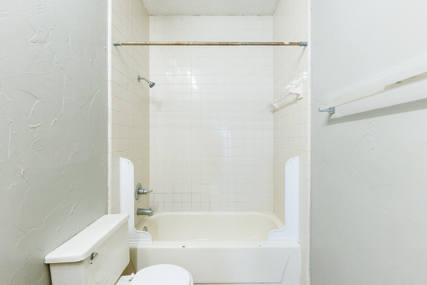 7405 Avenue X, Unit 103 Lubbock, TX 79423 - Photo 24 of 33 a bathroom with a bathtub and a shower