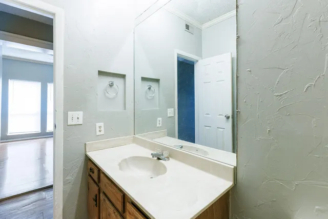 a bathroom with a sink and a mirror
