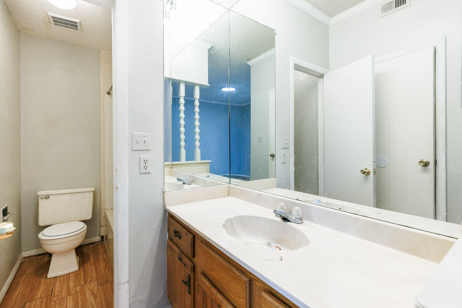 7405 Avenue X, Unit 103 Lubbock, TX 79423 - Photo 29 of 33 a bathroom with a sink and a mirror