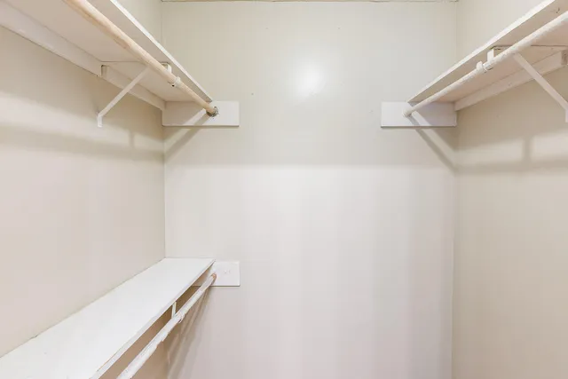 a view of a room with racks on the wall