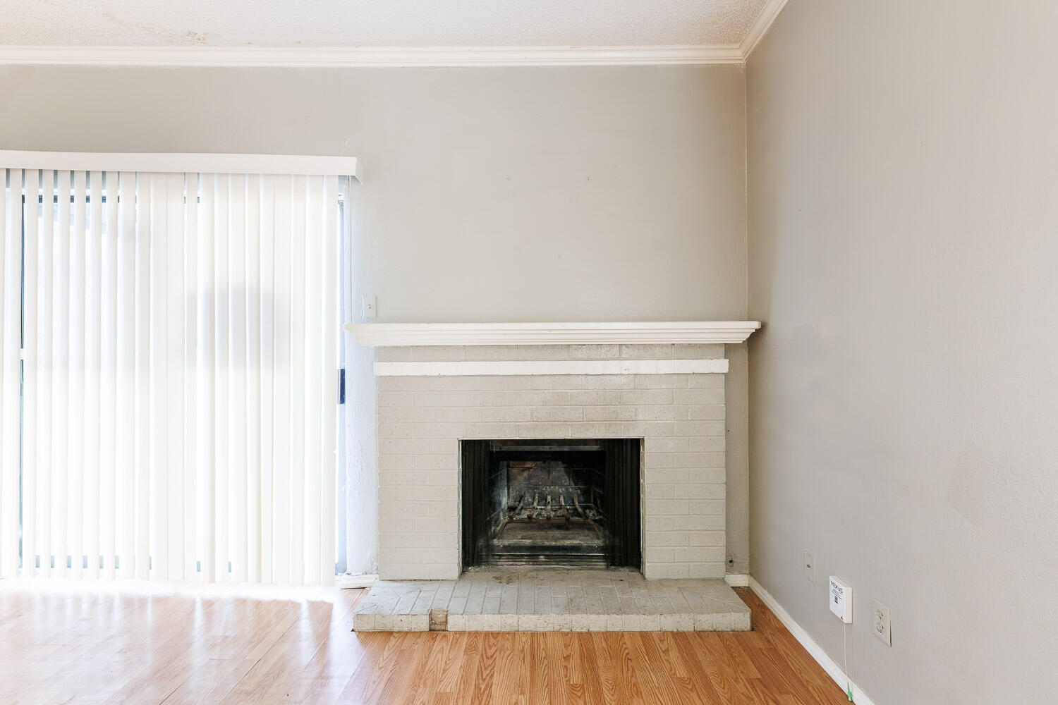 7405 Avenue X, Unit 103 Lubbock, TX 79423 - Photo 8 of 33 a view of a livingroom with a fireplace and a window