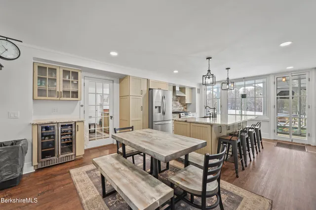 a view of a dining room with furniture and window