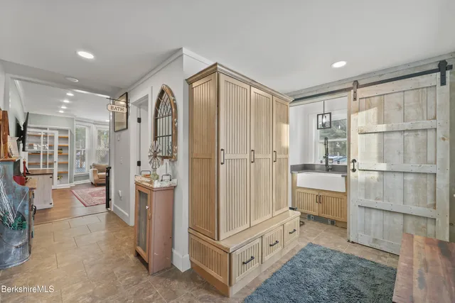 a view of a bedroom with wooden floor and bedroom