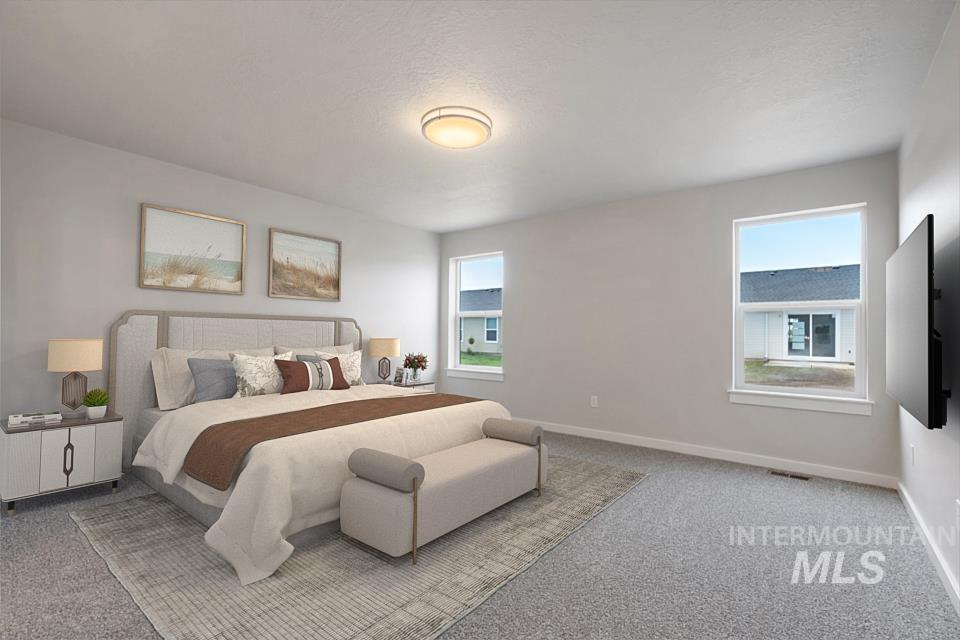 1355 Crescent Street Weiser, ID 83672 - Photo 16 of 31 Carpeted bedroom featuring baseboards