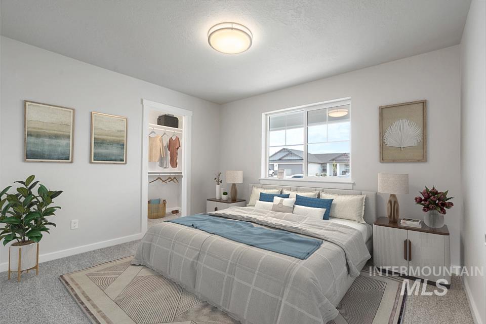 1355 Crescent Street Weiser, ID 83672 - Photo 6 of 31 Bedroom featuring carpet and a walk in closet