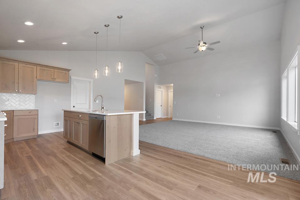 1355 Crescent Street Weiser, ID 83672 - Photo 31 of 31 Kitchen featuring dishwasher, ceiling fan, high vaulted ceiling, light countertops, and open floor plan