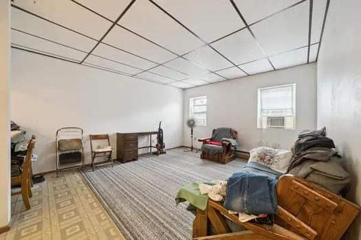 a bedroom with furniture and a wooden floor