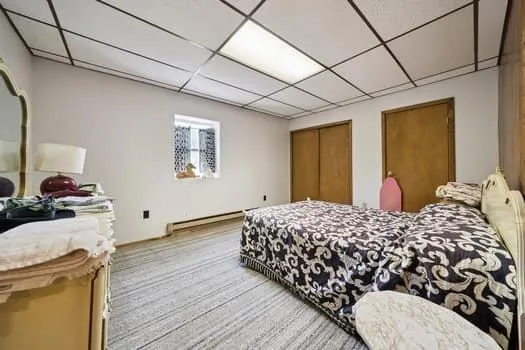 a bedroom with bed and window