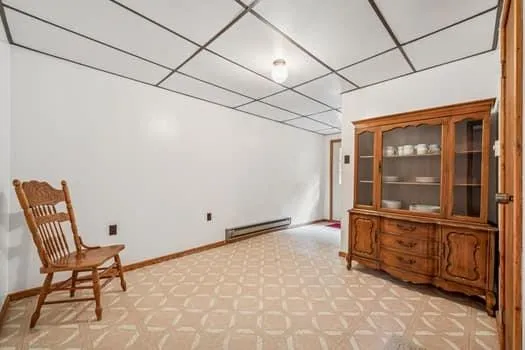 a view of a room with furniture and windows