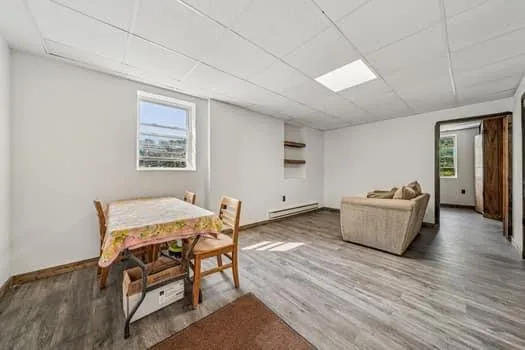 a living room with furniture and a table