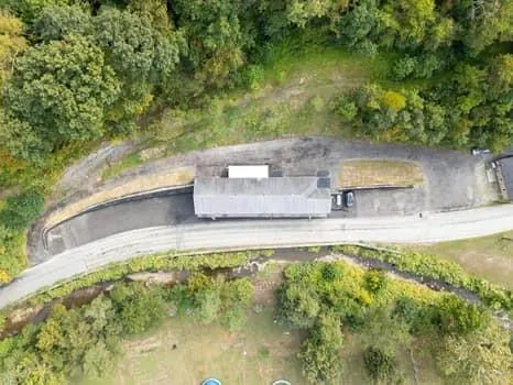 a view of a swimming pool with a yard