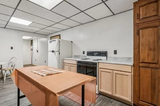 a kitchen that has a table and chairs in it