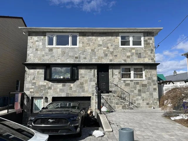 a kitchen with a sink stainless steel appliances and cabinets