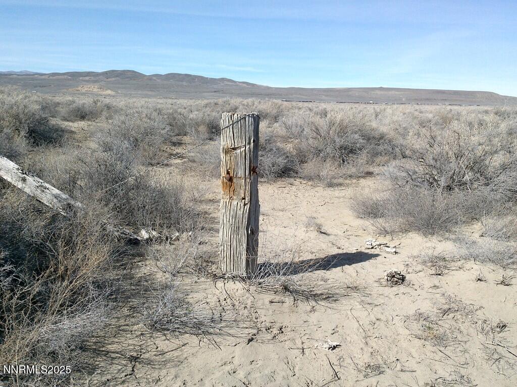 30 7-381-08 Lovelock, NV 89419 - Photo 17 of 31 a view of a dry field with mountains in the background