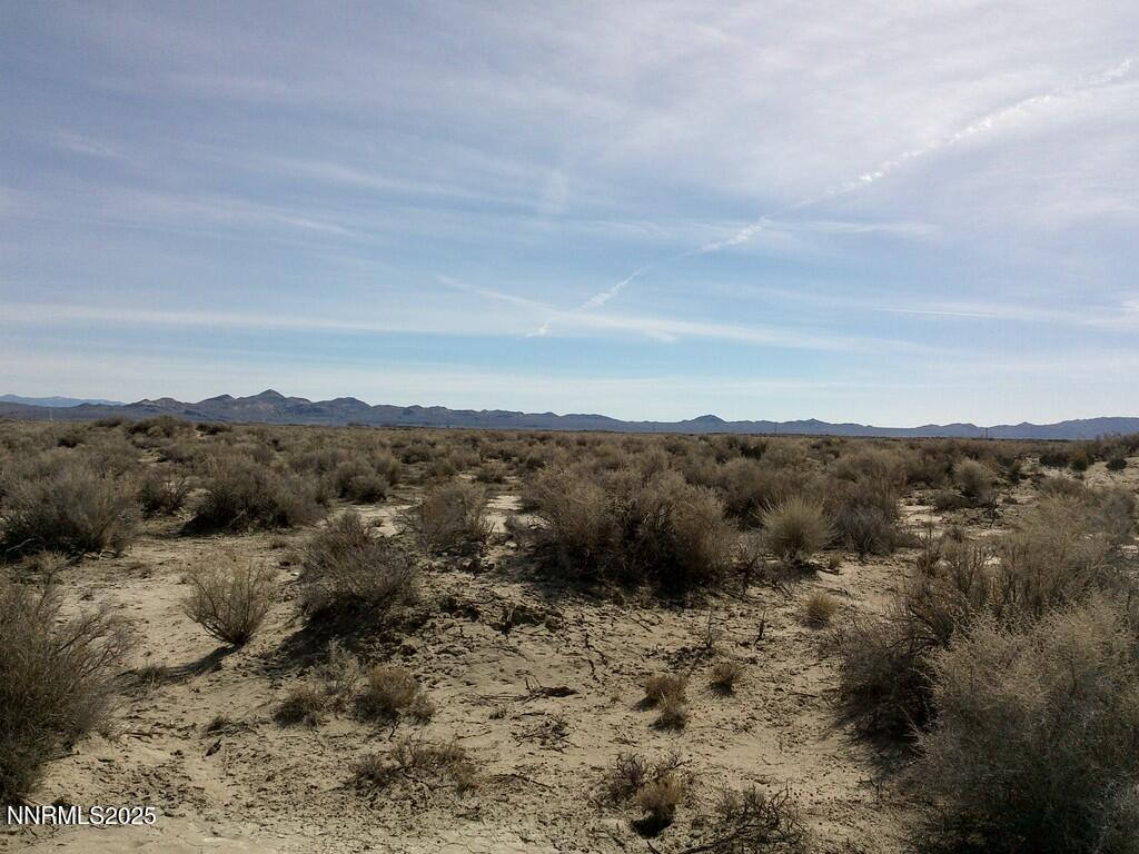 30 7-381-08 Lovelock, NV 89419 - Photo 9 of 31 a view of a dry yard with mountains in the background