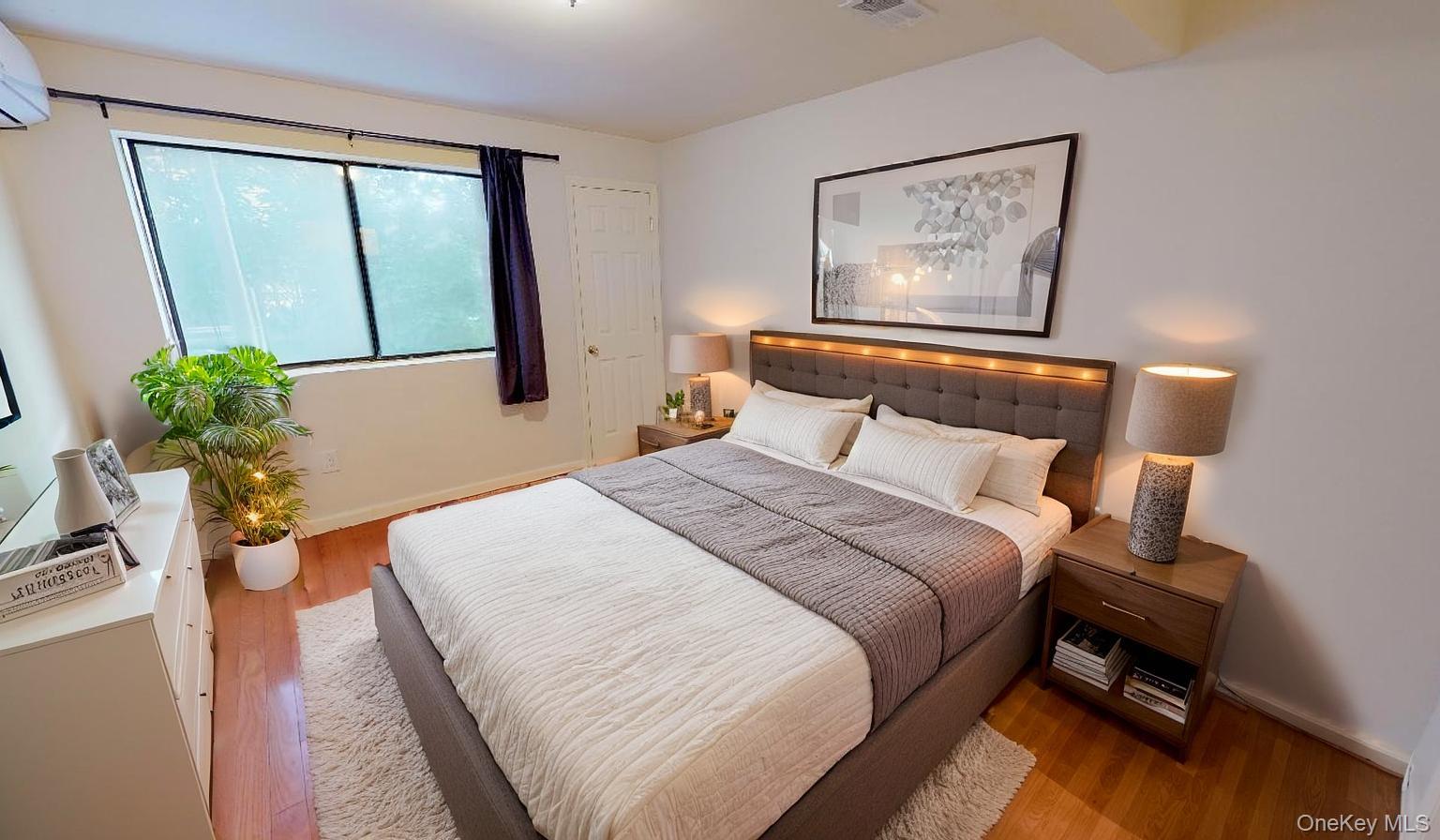 110-19 72nd Road, Unit 3A Queens, NY 11375 - Photo 12 of 20 a bedroom with a bed and a large window