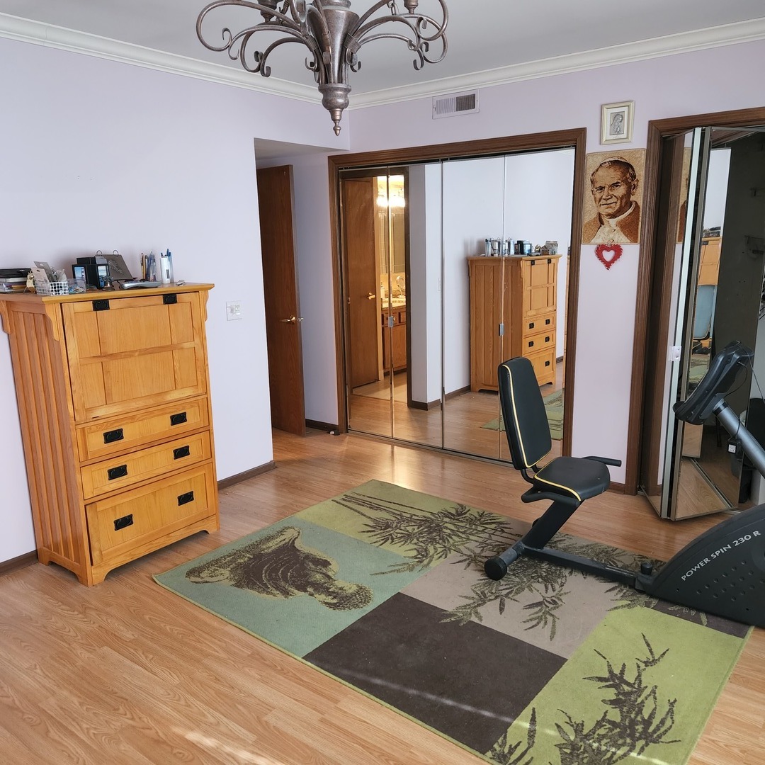 6441 West Warner Avenue, Unit 506 Chicago, IL 60634 - Photo 11 of 15 a view of a room with gym equipment