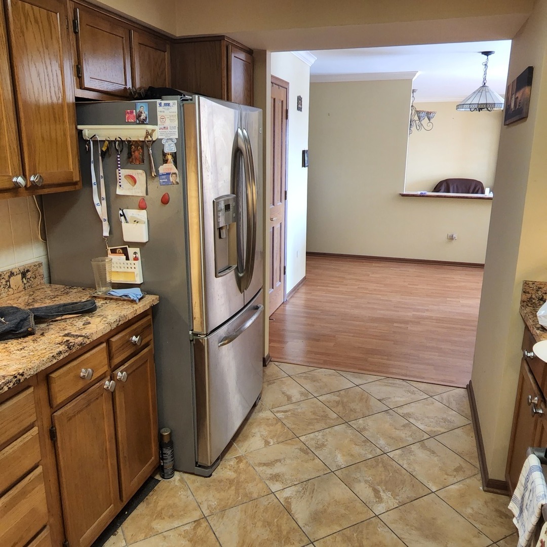 6441 West Warner Avenue, Unit 506 Chicago, IL 60634 - Photo 3 of 15 a kitchen with stainless steel appliances a refrigerator and a stove