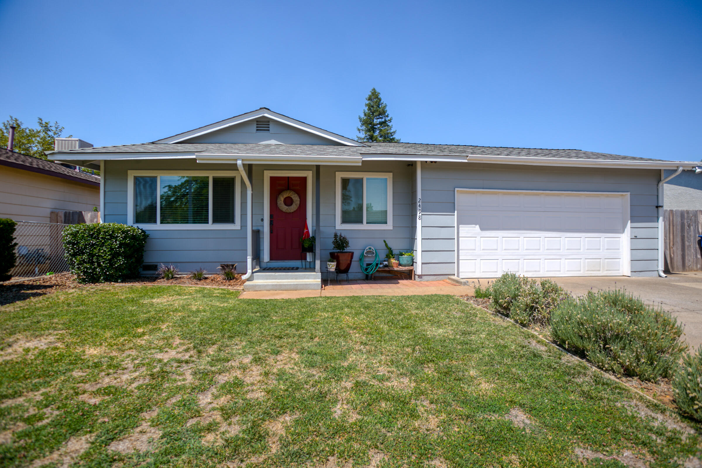 a front view of a house with a yard
