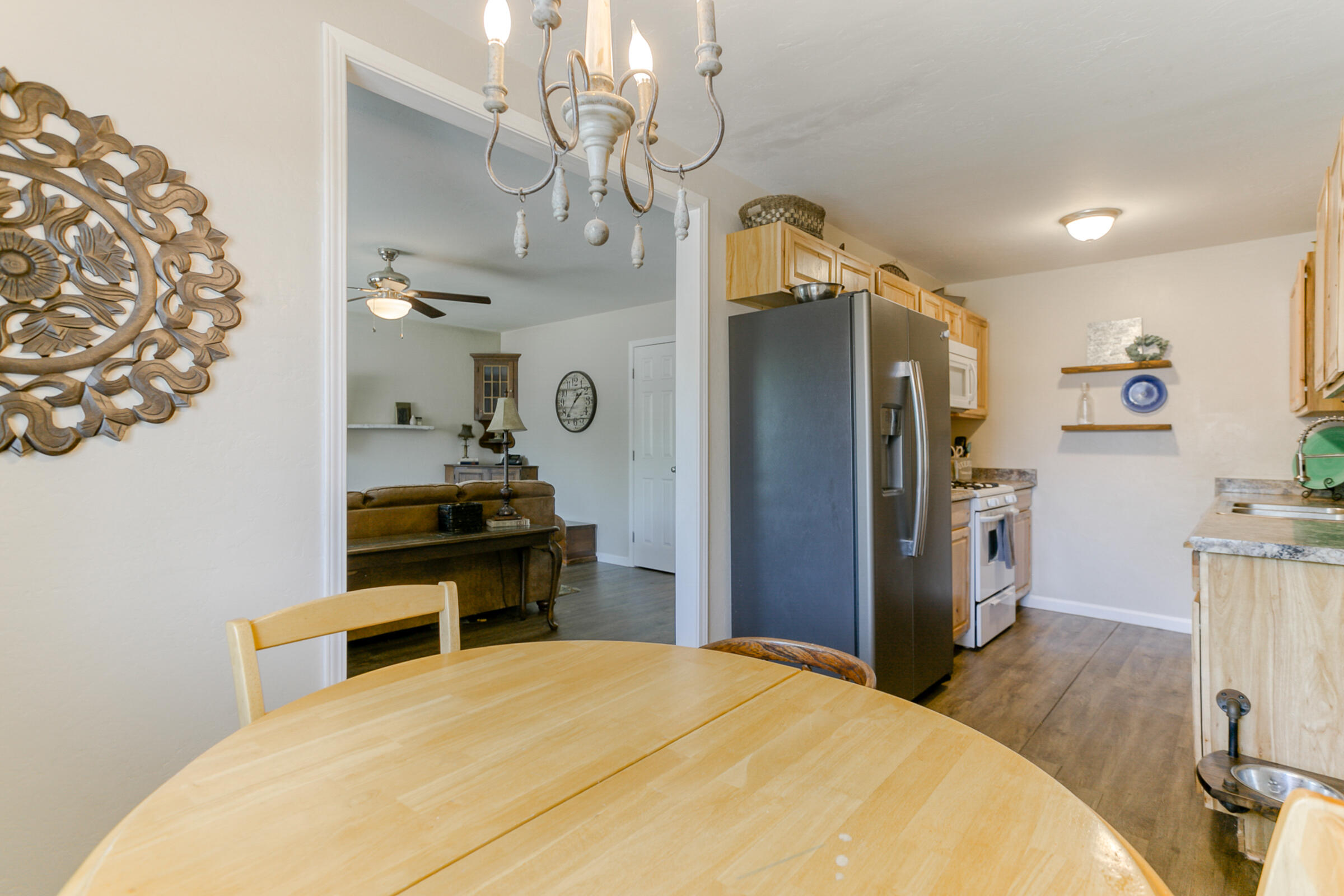 2498 Saturn Redding, CA 96002 - Photo 11 of 40 a bedroom with a bed and a chandelier