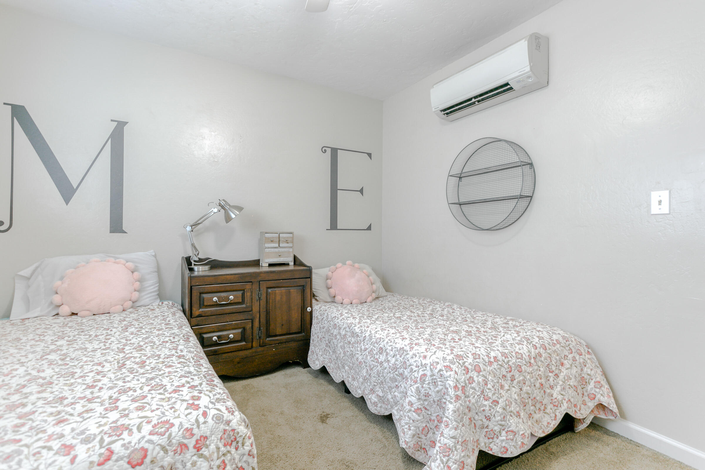 2498 Saturn Redding, CA 96002 - Photo 23 of 40 a bedroom with a bed and wooden floor