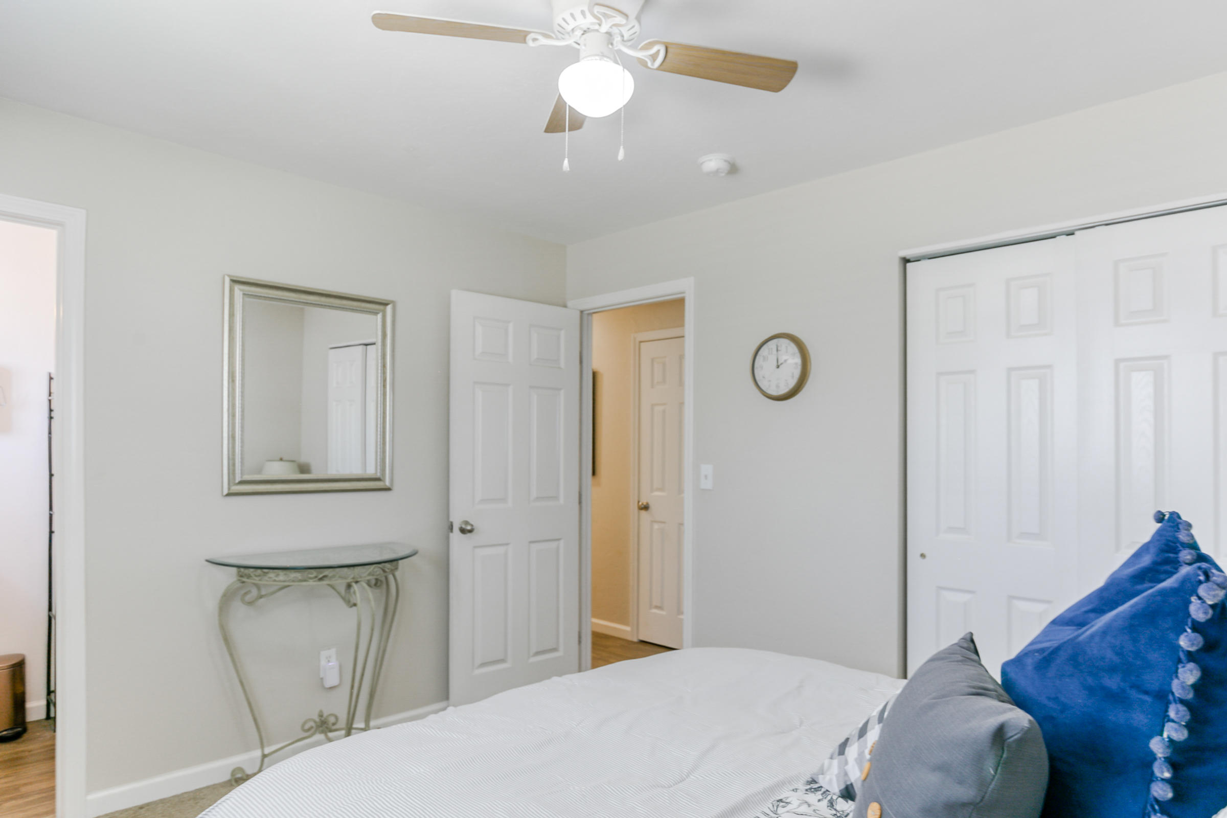 2498 Saturn Redding, CA 96002 - Photo 26 of 40 a bedroom with a bed and a chandelier