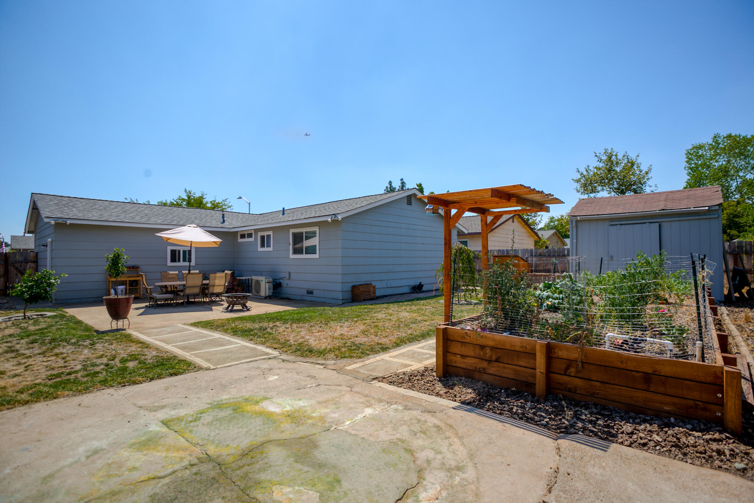 2498 Saturn Redding, CA 96002 - Photo 37 of 40 a view of a house with backyard and sitting area