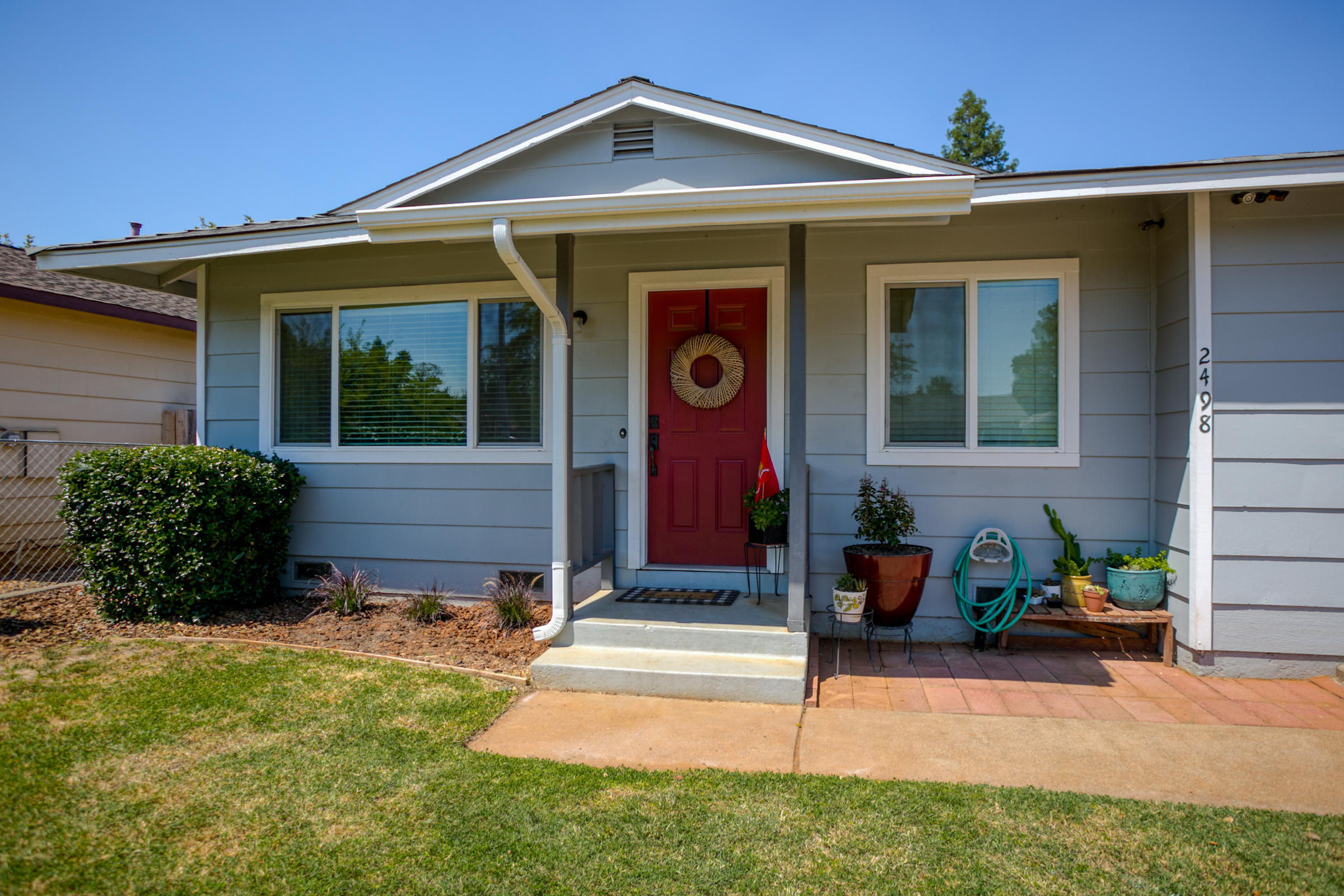2498 Saturn Redding, CA 96002 - Photo 5 of 40 a front view of a house with porch