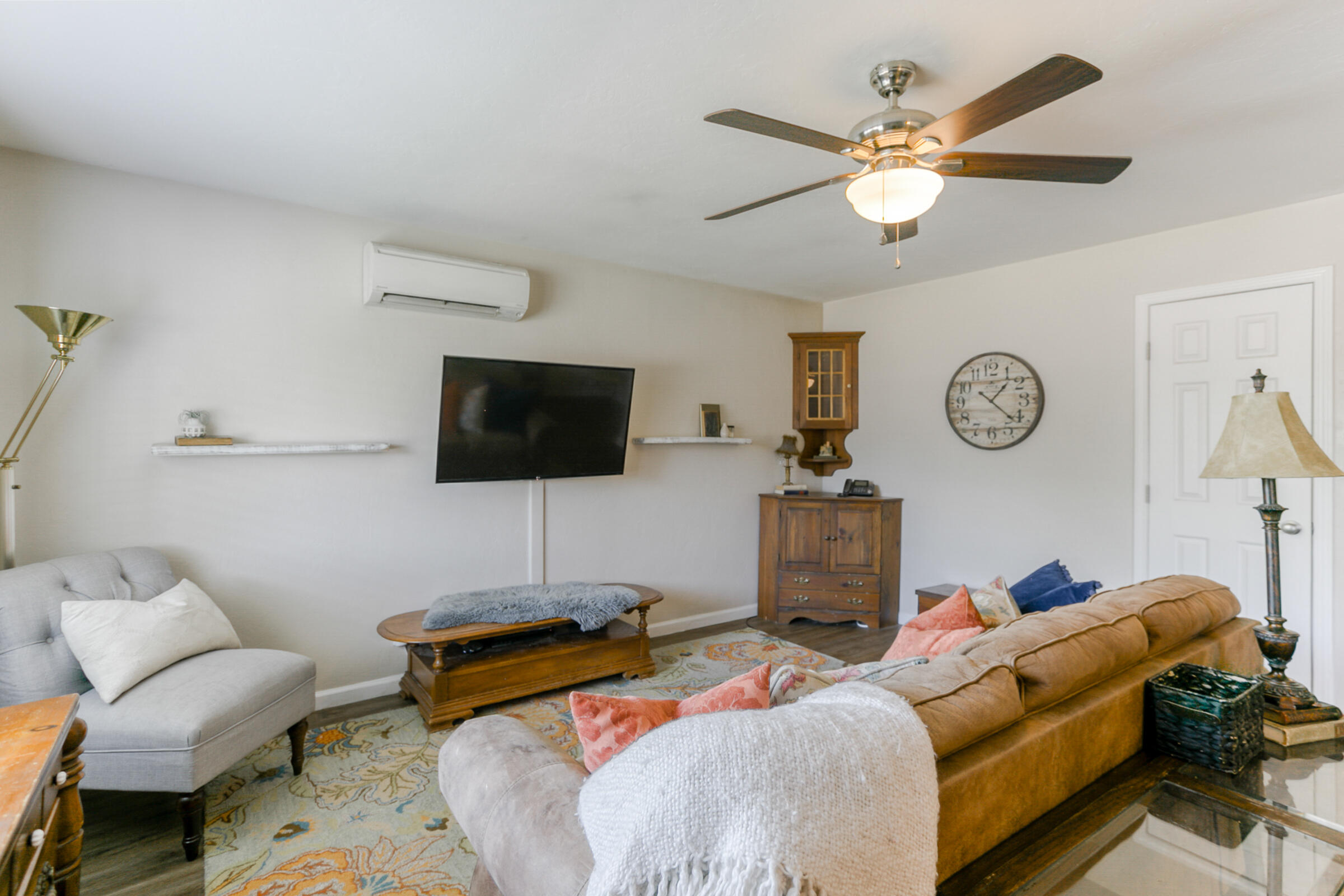 2498 Saturn Redding, CA 96002 - Photo 6 of 40 a living room with furniture a flat screen tv and a wall painting