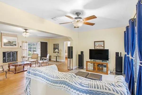 a living room with furniture and a flat screen tv