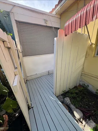 a view of a balcony with wooden floor