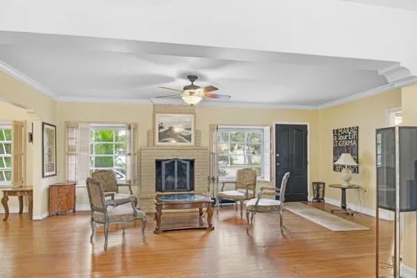 a living room with furniture and a fireplace