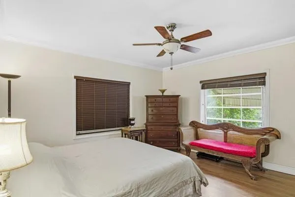 a bedroom with a bed and a chair