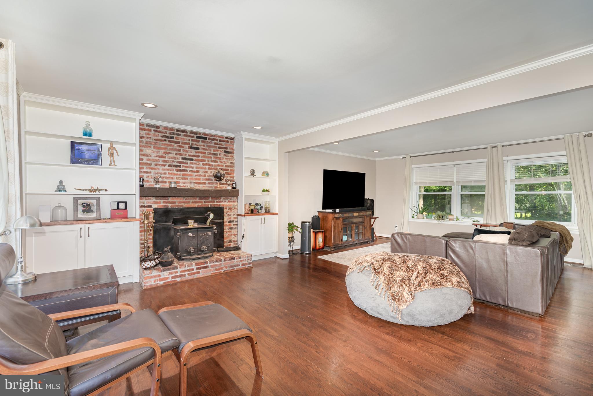 5214 Forge Road Perry Hall, MD 21128 - Photo 15 of 35 a living room with furniture a fireplace and a flat screen tv