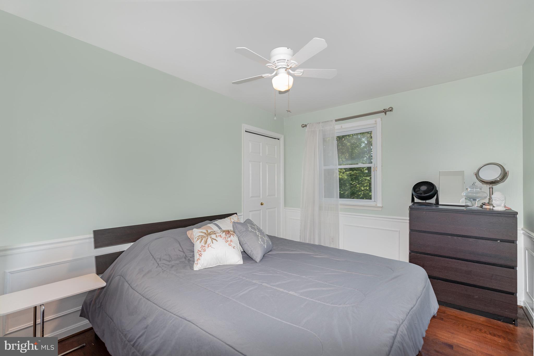 5214 Forge Road Perry Hall, MD 21128 - Photo 18 of 35 a bedroom with a bed and a chandelier