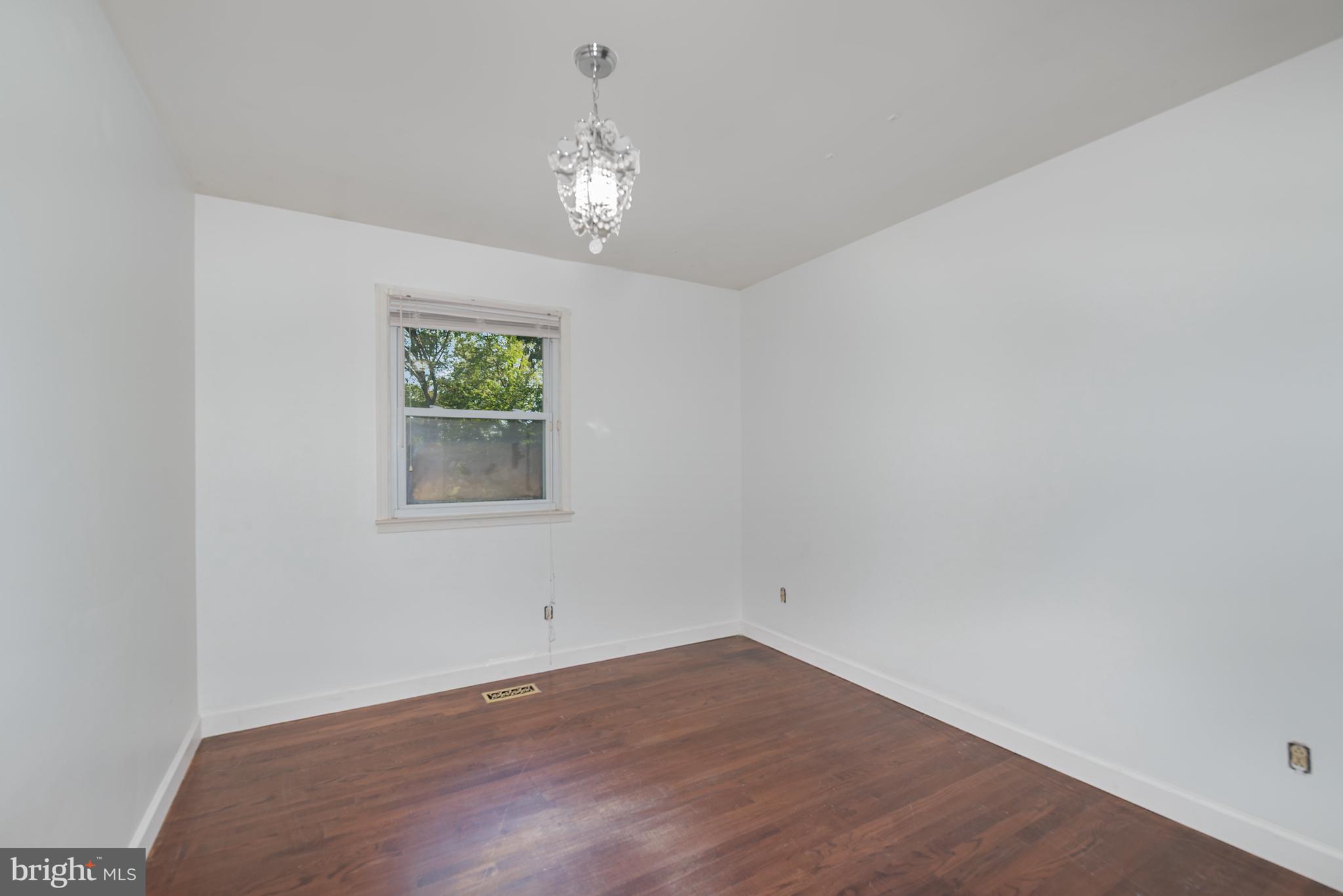 5214 Forge Road Perry Hall, MD 21128 - Photo 19 of 35 wooden floor in an empty room with a window