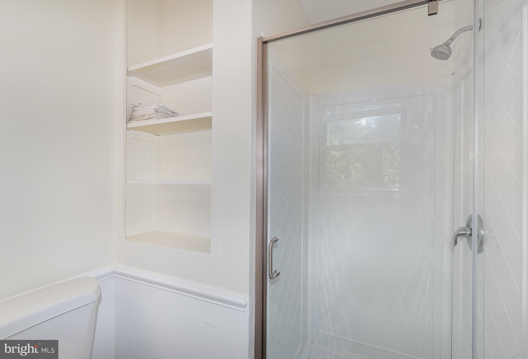 5214 Forge Road Perry Hall, MD 21128 - Photo 24 of 35 a bathroom with a glass shower door