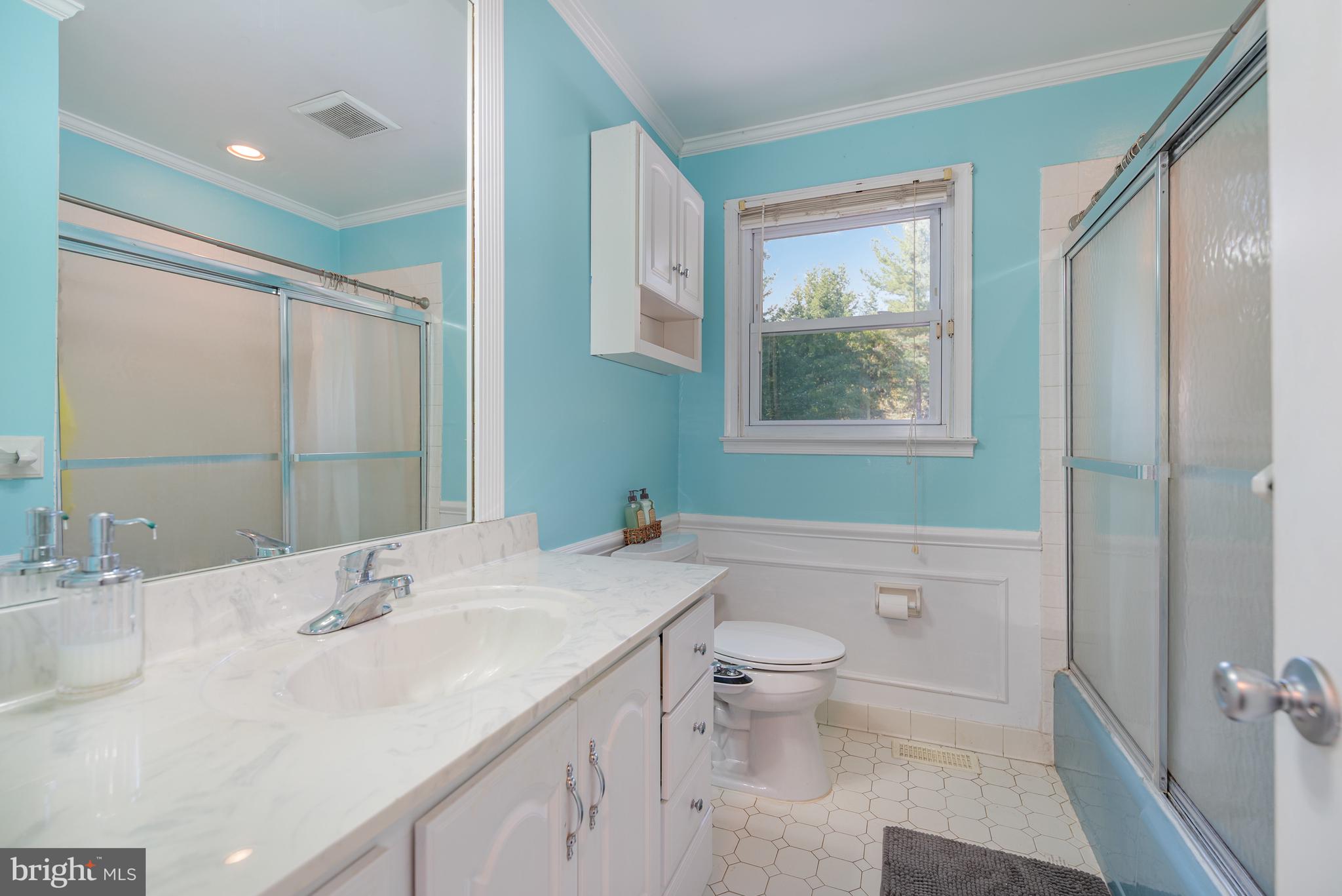 5214 Forge Road Perry Hall, MD 21128 - Photo 25 of 35 a bathroom with a sink a toilet and shower